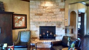 Natural Limestone Veneer Enhancing Fireplace in Texas Home Interior