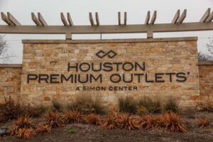 Natural Gold Limestone Veneer on Commercial Signage in Houston, TX